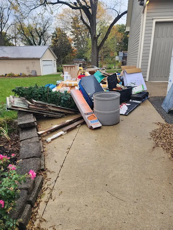 Dumpster being loaded with debris for 10 Yard Dumpster Rental in Winnetka